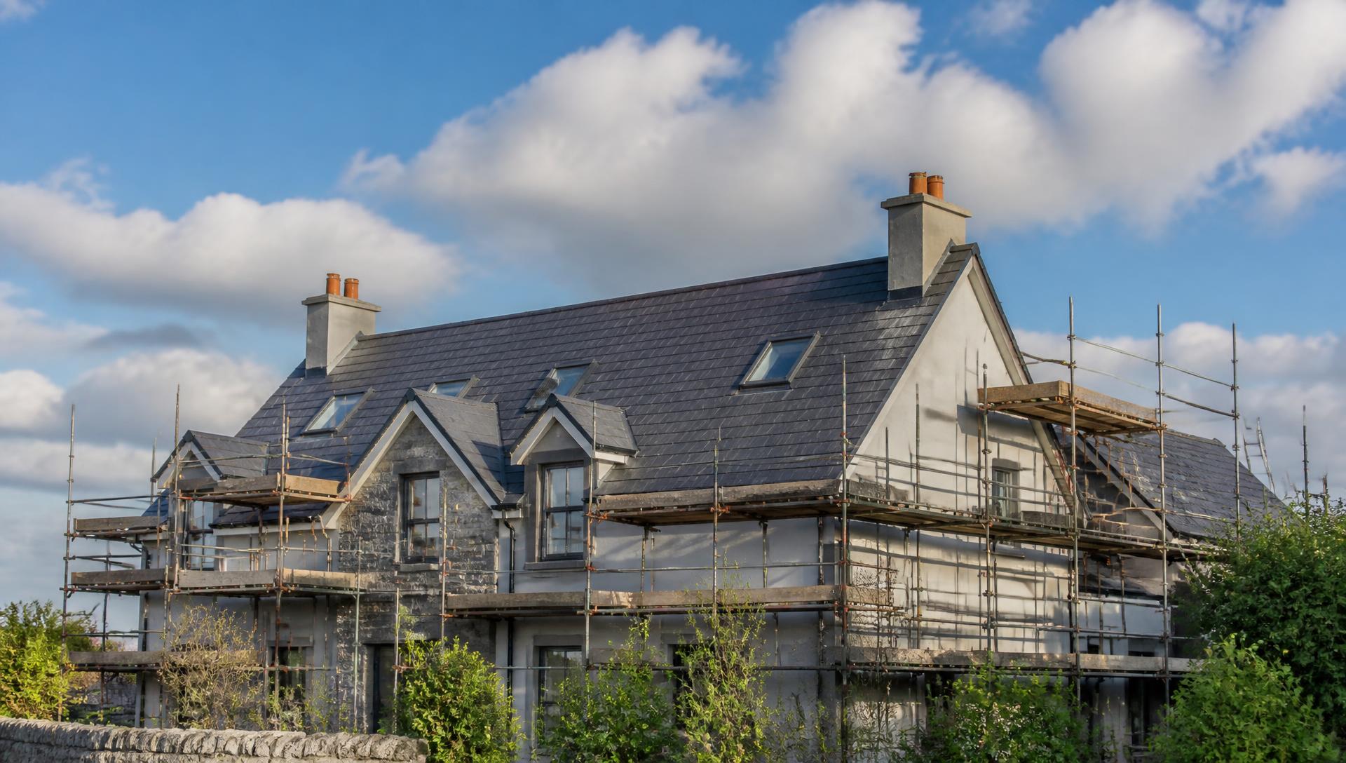 Irish home with a newly installed slate roof and scaffolding in place